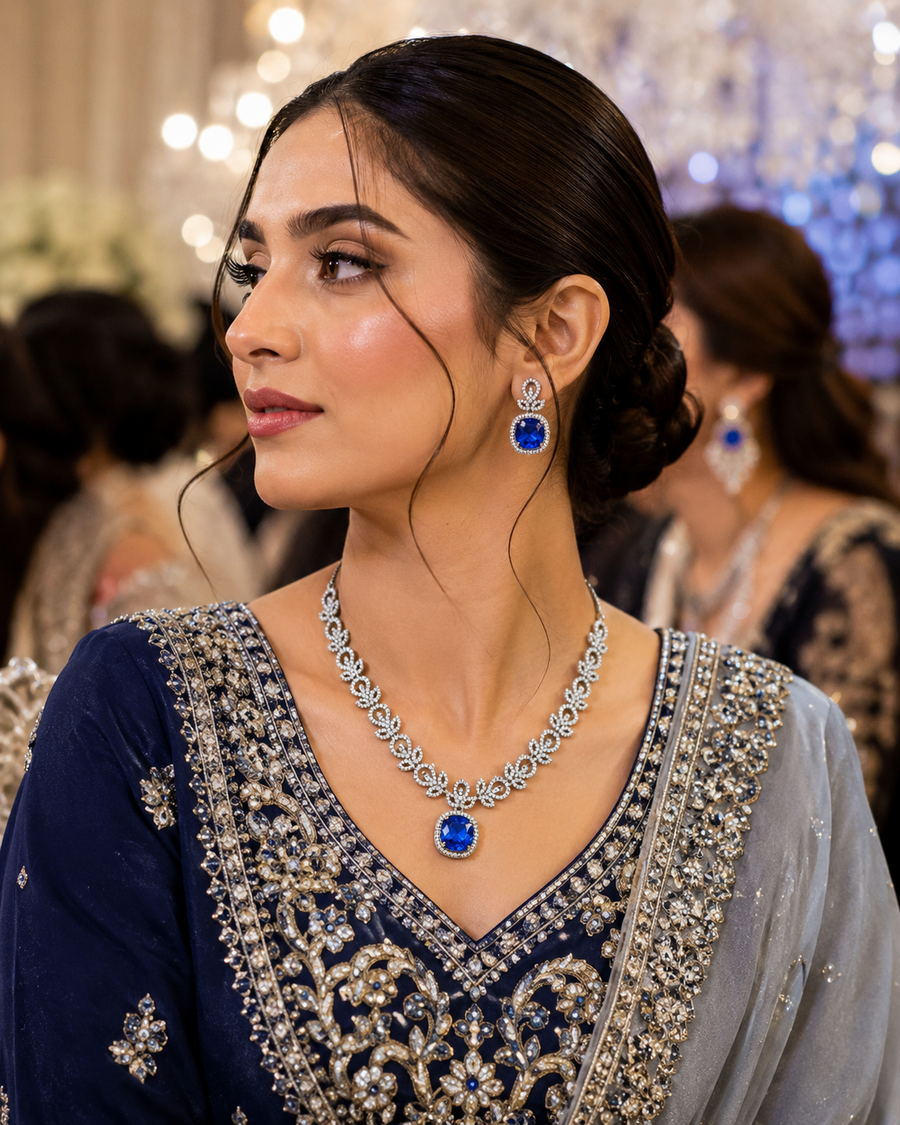 Woman wearing gold necklace design and earrings for women - Tehreer Jewels