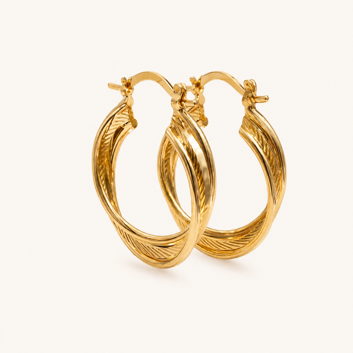 Tehreer Jewels – Elegant Twisted Double Hoop Earrings – Gold Tone