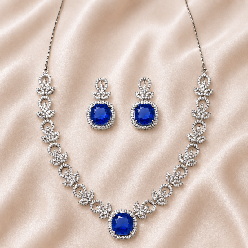 Jewelry set with necklace and earrings featuring blue gemstones